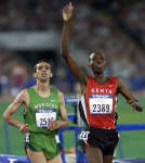 Noah Ngeny (R) celebrates while Hicham El Guerrouj looks on. REUTERS/Mark Baker 