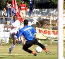 Sangram Mukherjee saves off Bala Usman.